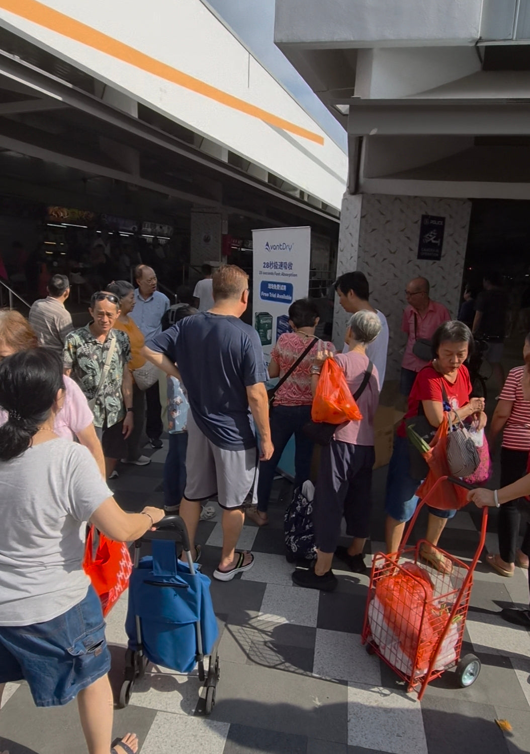 Elderly care walkabout Singapore - People gathering around AvantDry walkabout to buy